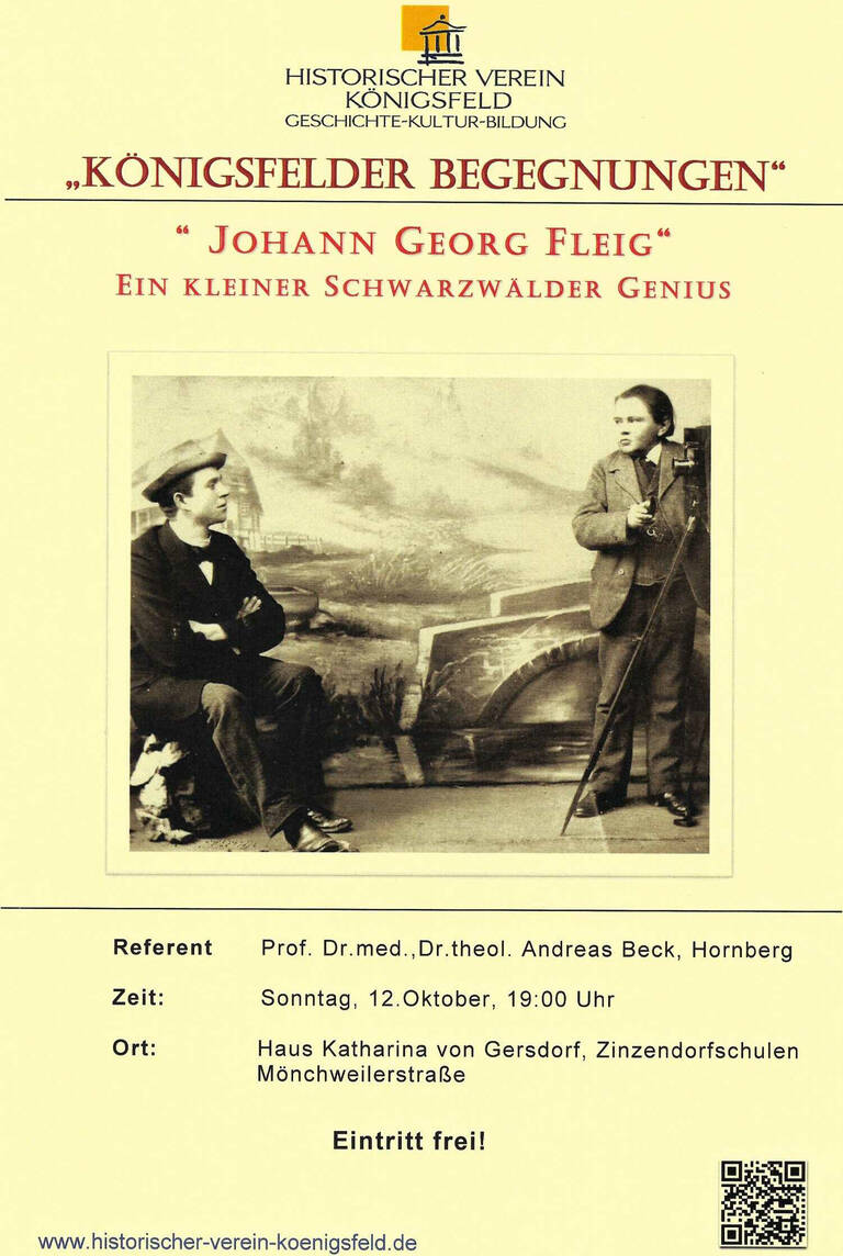 Das Plakat wirbt für eine Veranstaltung des Historischen Vereins Königsfeld mit dem Titel "Königsfelder Begegnungen – Johann Georg Fleig", zeigt ein altes Foto zweier Männer und gibt Informationen zu Datum, Uhrzeit und Ort der Veranstaltung an.