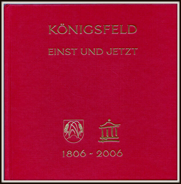 Das Bild zeigt ein rotes Buchcover mit dem Titel „Königsfeld Einst und Jetzt“, zwei goldenen Symbolen und den Jahreszahlen 1806–2006.